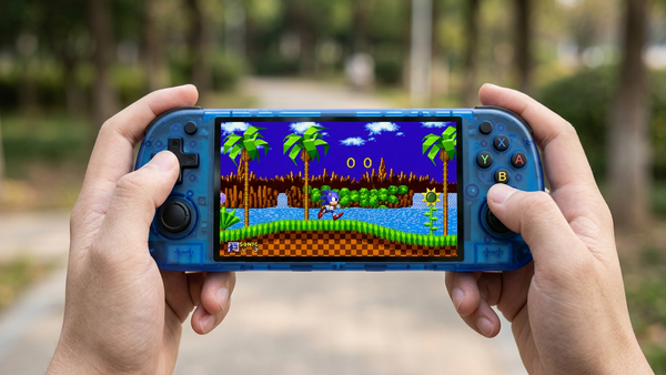 Hands holding the translucent blue R50H handheld showing a Sonic-style platform scene, styled product artwork